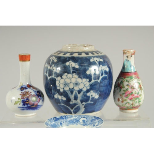 11 - A GROUP OF MIXED ORIENTAL PORCELAIN ITEMS, including a famille rose jar, a blue and white prunus jar... 