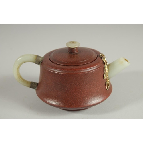 110 - A CHINESE YIXING TEAPOT WITH MOUNDED JADE HANDLE AND SPOUT, with impressed marks to base and inner l... 