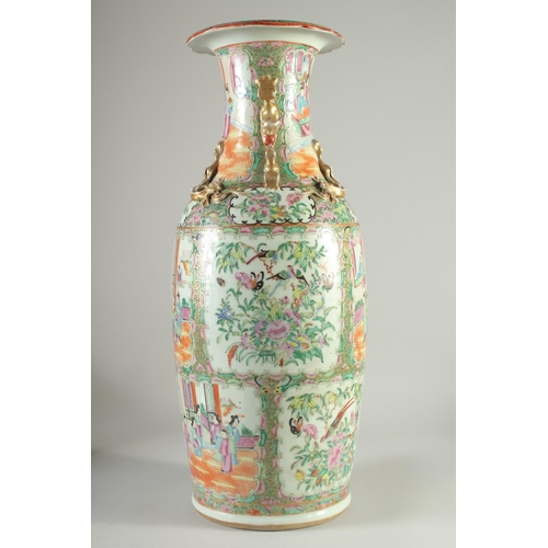 114 - A LARGE CHINESE CANTON FAMILLE ROSE PORCELAIN VASE, the neck with moulded chilong, painted with pane... 