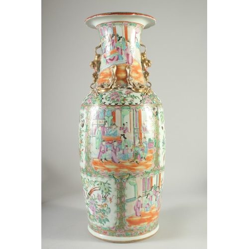 114 - A LARGE CHINESE CANTON FAMILLE ROSE PORCELAIN VASE, the neck with moulded chilong, painted with pane... 