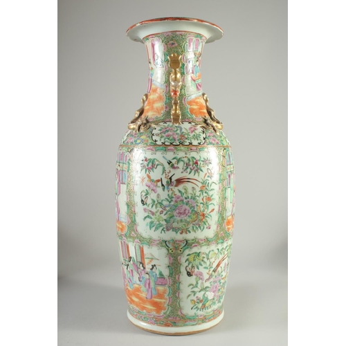 114 - A LARGE CHINESE CANTON FAMILLE ROSE PORCELAIN VASE, the neck with moulded chilong, painted with pane... 