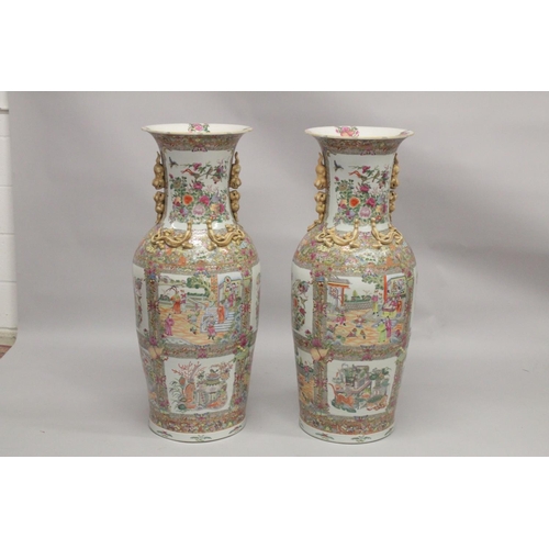 115 - AN IMPRESSIVE PAIR OF CHINESE CANTON FAMILLE ROSE PORCELAIN FLOOR-STANDING VASES, beautifully painte... 