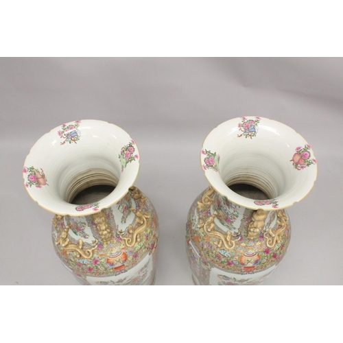 115 - AN IMPRESSIVE PAIR OF CHINESE CANTON FAMILLE ROSE PORCELAIN FLOOR-STANDING VASES, beautifully painte... 