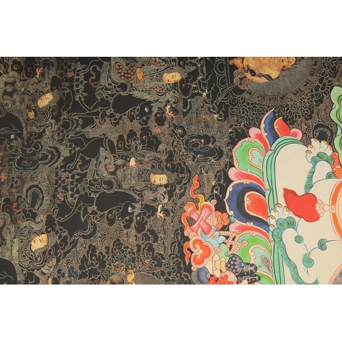 127 - A TIBETAN THANGKA, mounted on paper.