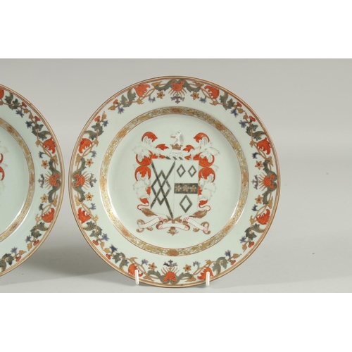 153 - A PAIR OF CHINESE EXPORT ARMORIAL PORCELAIN PLATES, finely painted with central coat of arms with fo... 