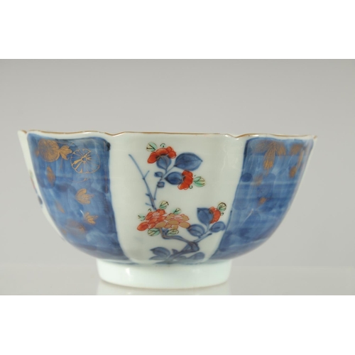 154 - A 19TH CENTURY JAPANESE BLUE AND WHITE IMARI PORCELAIN BOWL, decorated with panels of flora, charact... 