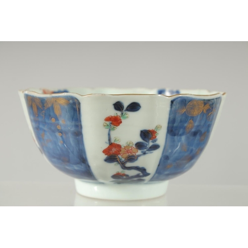 154 - A 19TH CENTURY JAPANESE BLUE AND WHITE IMARI PORCELAIN BOWL, decorated with panels of flora, charact... 