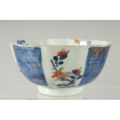 154 - A 19TH CENTURY JAPANESE BLUE AND WHITE IMARI PORCELAIN BOWL, decorated with panels of flora, charact... 