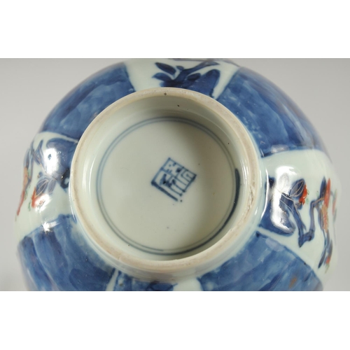 154 - A 19TH CENTURY JAPANESE BLUE AND WHITE IMARI PORCELAIN BOWL, decorated with panels of flora, charact... 