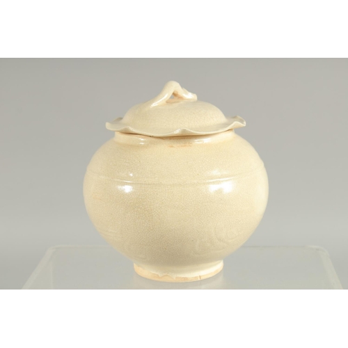 164 - A CHINESE DING WARE PORCELAIN JAR AND COVER, 12cm high.