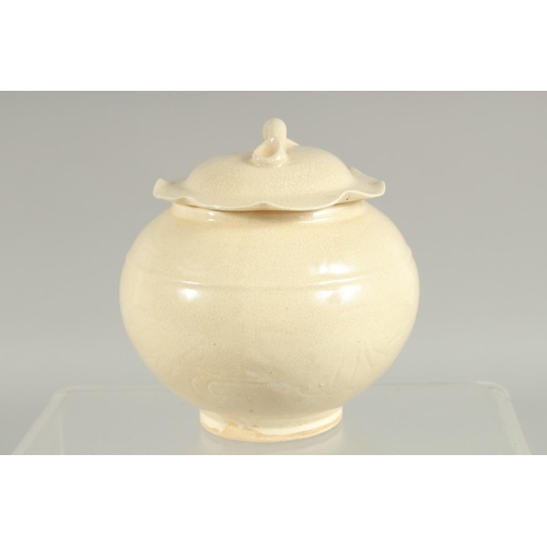 164 - A CHINESE DING WARE PORCELAIN JAR AND COVER, 12cm high.