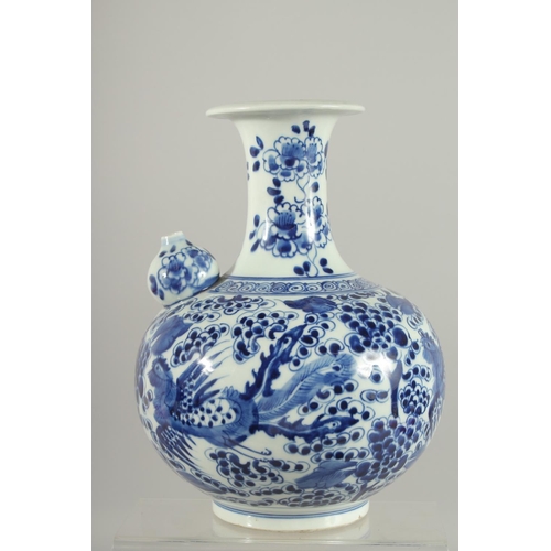 166 - A FINE CHINESE BLUE AND WHITE PORCELAIN KENDI, painted with exotic birds and flora, 26cm high.