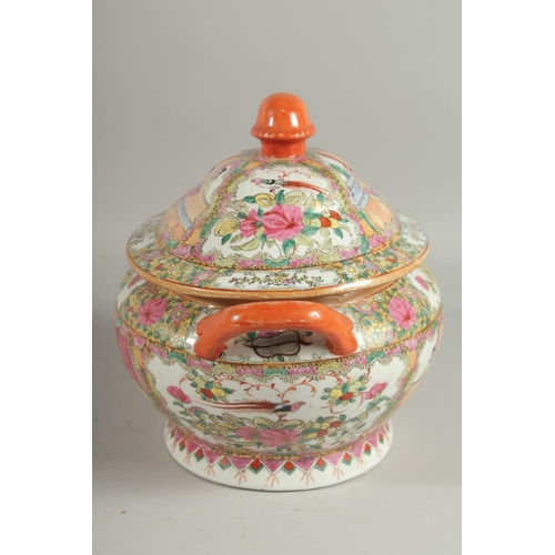 167 - A CHINESE CANTON FAMILLE ROSE PORCELAIN TUREEN AND COVER, painted with panels of scenes with figures... 