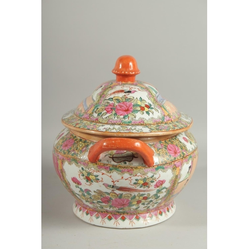 167 - A CHINESE CANTON FAMILLE ROSE PORCELAIN TUREEN AND COVER, painted with panels of scenes with figures... 