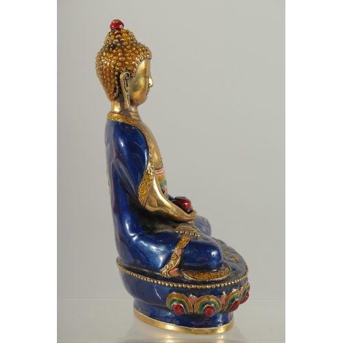 170 - A NEPALESE ENAMELLED BRASS BUDDHA, 20cm high.