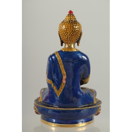 170 - A NEPALESE ENAMELLED BRASS BUDDHA, 20cm high.