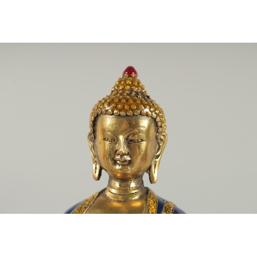 170 - A NEPALESE ENAMELLED BRASS BUDDHA, 20cm high.