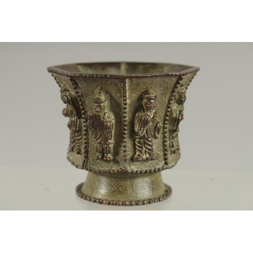 172 - A CHINESE BRONZE CUP WITH RELIEF CAST FIGURES, mark to base possibly Da Tang Zhen Guan (true officia... 