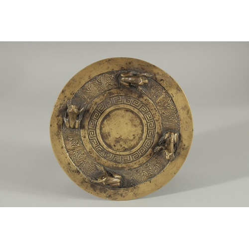 173 - AN ANNAMESE BRONZE RAIN DRUM WITH RELIEF CAST FROGS, 16cm diameter.