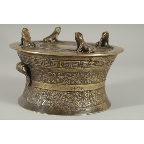 173 - AN ANNAMESE BRONZE RAIN DRUM WITH RELIEF CAST FROGS, 16cm diameter.