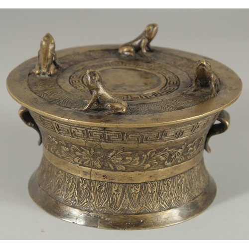 173 - AN ANNAMESE BRONZE RAIN DRUM WITH RELIEF CAST FROGS, 16cm diameter.