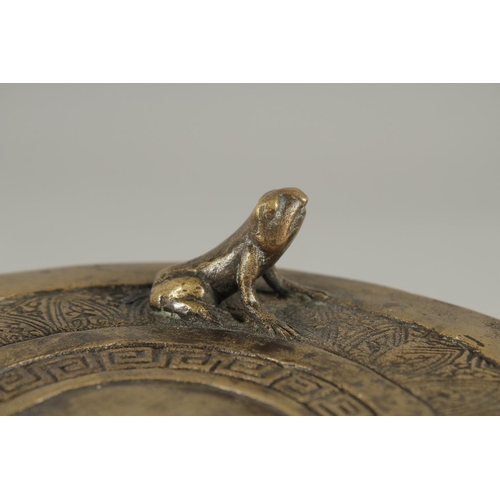 173 - AN ANNAMESE BRONZE RAIN DRUM WITH RELIEF CAST FROGS, 16cm diameter.