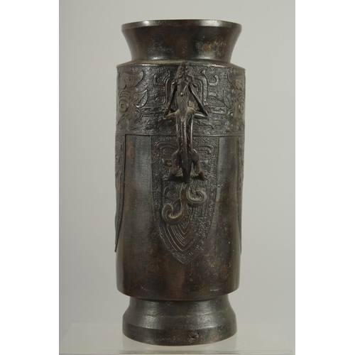 174 - A CHINESE BRONZE VASE WITH TWIN CHILONG HANDLES, with archaic style mask decoration, 28cm high.