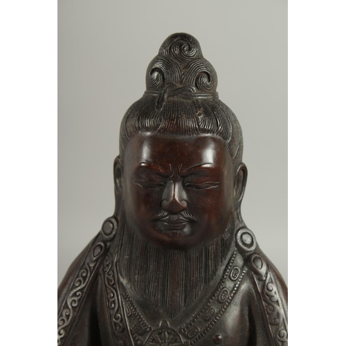 175 - A FINE TIBETAN BRONZE FIGURE OF LAMA TROPTE TUNGDEN DJABO, with long beard and hair gathered in a bu... 