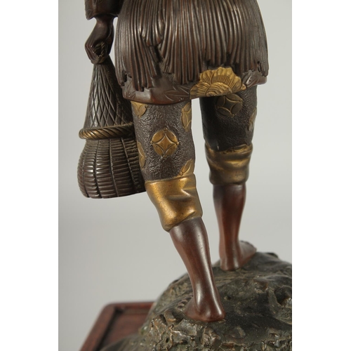 176 - A FINE AND LARGE JAPANESE MEIJI BRONZE AND CLOISONNE FIGURAL LAMP, with okimono of a man holding a b... 