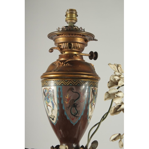 176 - A FINE AND LARGE JAPANESE MEIJI BRONZE AND CLOISONNE FIGURAL LAMP, with okimono of a man holding a b... 