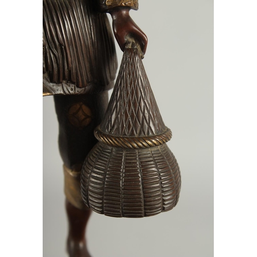 176 - A FINE AND LARGE JAPANESE MEIJI BRONZE AND CLOISONNE FIGURAL LAMP, with okimono of a man holding a b... 