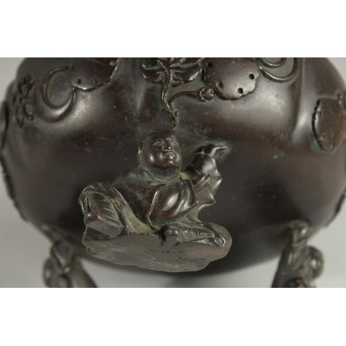 177 - A JAPANESE BRONZE PETAL FORM BOWL, raised on three mounted figural feet, the bowl with relief mon de... 