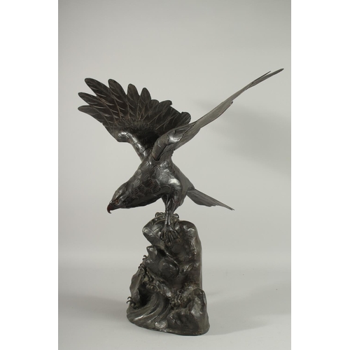 188 - AN IMPRESSIVE JAPANESE SECTIONAL BRONZE STATUE OF AN EAGLE, with wings outstretched, stood upon a ro... 