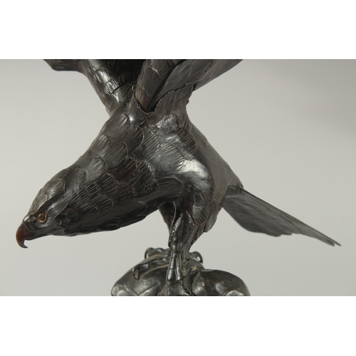 188 - AN IMPRESSIVE JAPANESE SECTIONAL BRONZE STATUE OF AN EAGLE, with wings outstretched, stood upon a ro... 