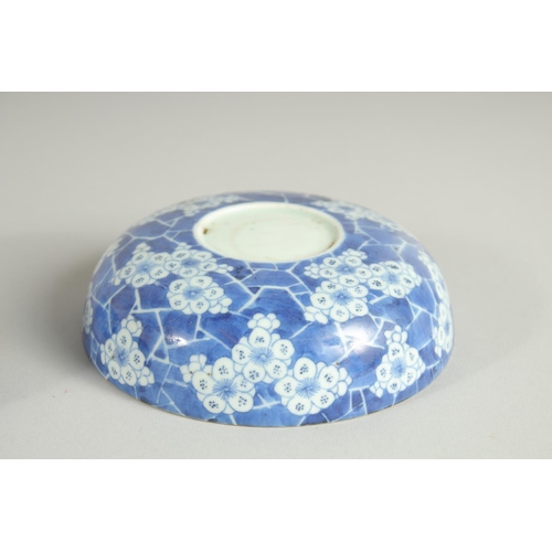 19 - A CHINESE BLUE AND WHITE PORCELAIN STACKING FOOD CONTAINER, comprising four sections, painted with f... 