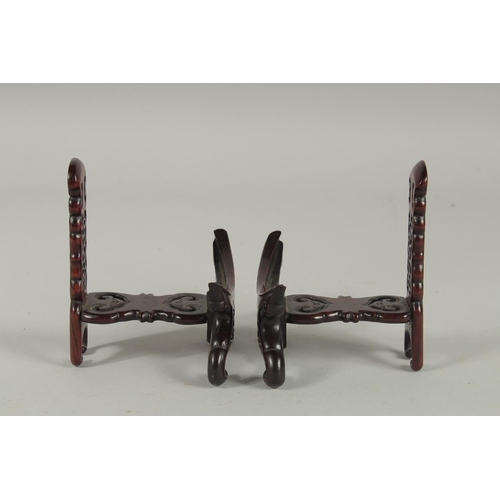 190 - A PAIR OF CHINESE CARVED AND PIERCED WOODEN STANDS.