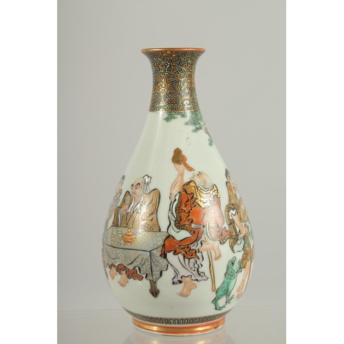 193 - A JAPANESE KUTANI PORCELAIN BOTTLE VASE, painted with figures with fine gilt highlights, the base wi... 