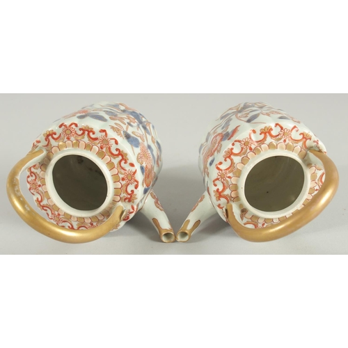 197 - A FINE PAIR OF IMARI PORCELAIN TEAPOTS, painted in the typical Imari palette with blue, red and gilt... 