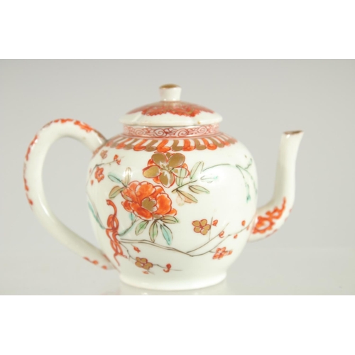 198 - A FINE JAPANESE KUTANI PORCELAIN MINIATURE TEAPOT, painted with flora and embellished with gilt high... 