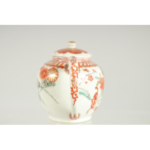 198 - A FINE JAPANESE KUTANI PORCELAIN MINIATURE TEAPOT, painted with flora and embellished with gilt high... 