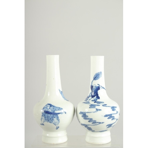 200 - A FINE PAIR OF CHINESE BLUE AND WHITE PORCELAIN BOTTLE VASES, one painted with a warrior riding a be... 