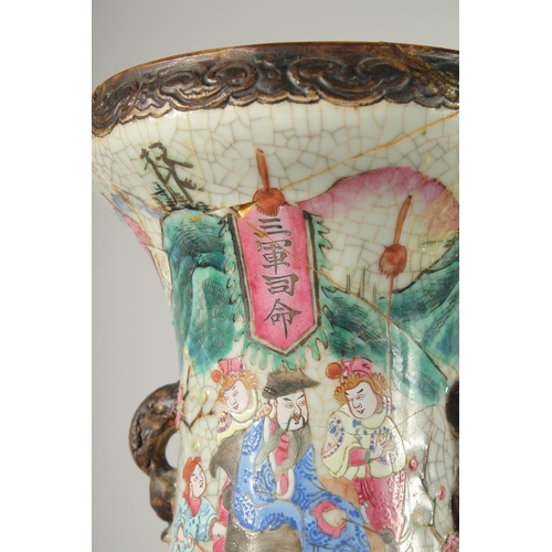 201 - A LARGE PAIR OF CHINESE FAMILLE ROSE PORCELAIN VASES, with moulded twin handles, each painted with a... 