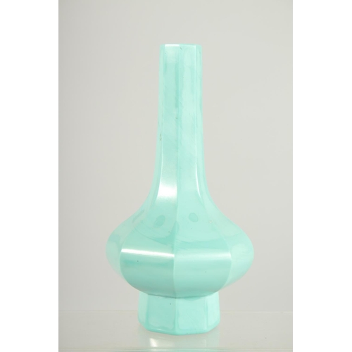 203 - A FINE TURQUOISE PEKING GLASS OCTAGONAL VASE, 19cm high.