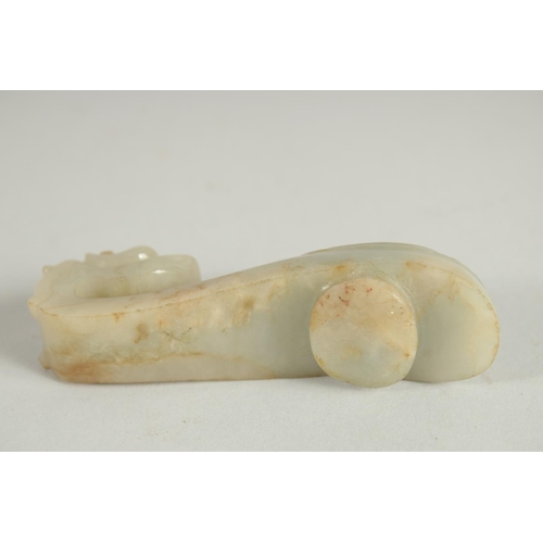 205 - A 19TH CENTURY CHINESE CARVED JADE BELT HOOK, in the form of a dragon, 8.5cm long.