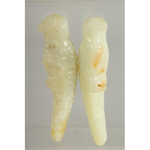 206 - TWO CHINESE CARVED JADE PARROTS, 9.5cm.