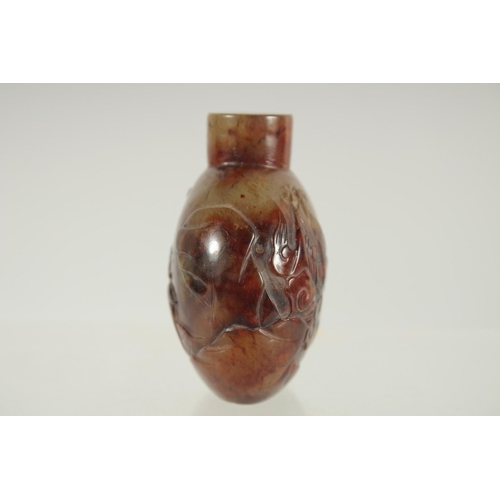 208 - A FINE CHINESE CARVED HARDSTONE SNUFF BOTTLE, one side carved with an immortal and monkey, the rever... 