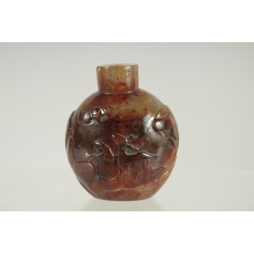 208 - A FINE CHINESE CARVED HARDSTONE SNUFF BOTTLE, one side carved with an immortal and monkey, the rever... 