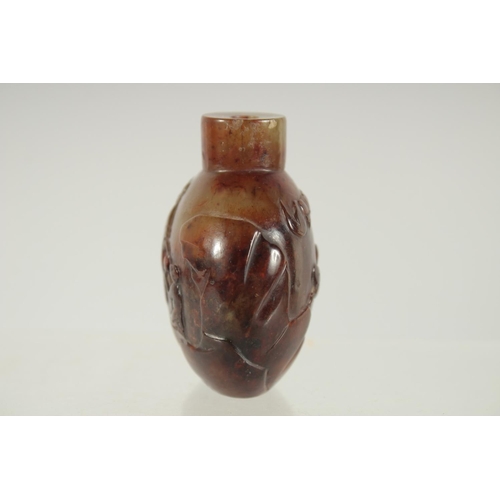 208 - A FINE CHINESE CARVED HARDSTONE SNUFF BOTTLE, one side carved with an immortal and monkey, the rever... 