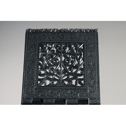 229 - A FINELY ENGRAVED MID-19TH CENTURY INDIAN EBONY QURAN STAND, 36.5cm wide at base (opened).