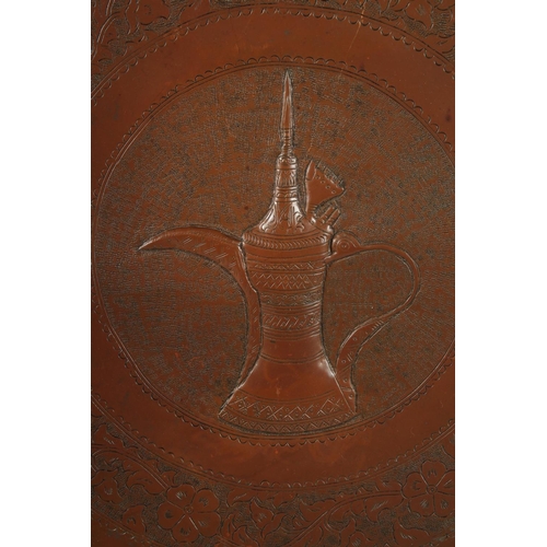 232 - A LARGE AND UNUSUAL 19TH CENTURY OMANI TINNED COPPER TRAY, with a jambiya coffee pot Dallah design, ... 